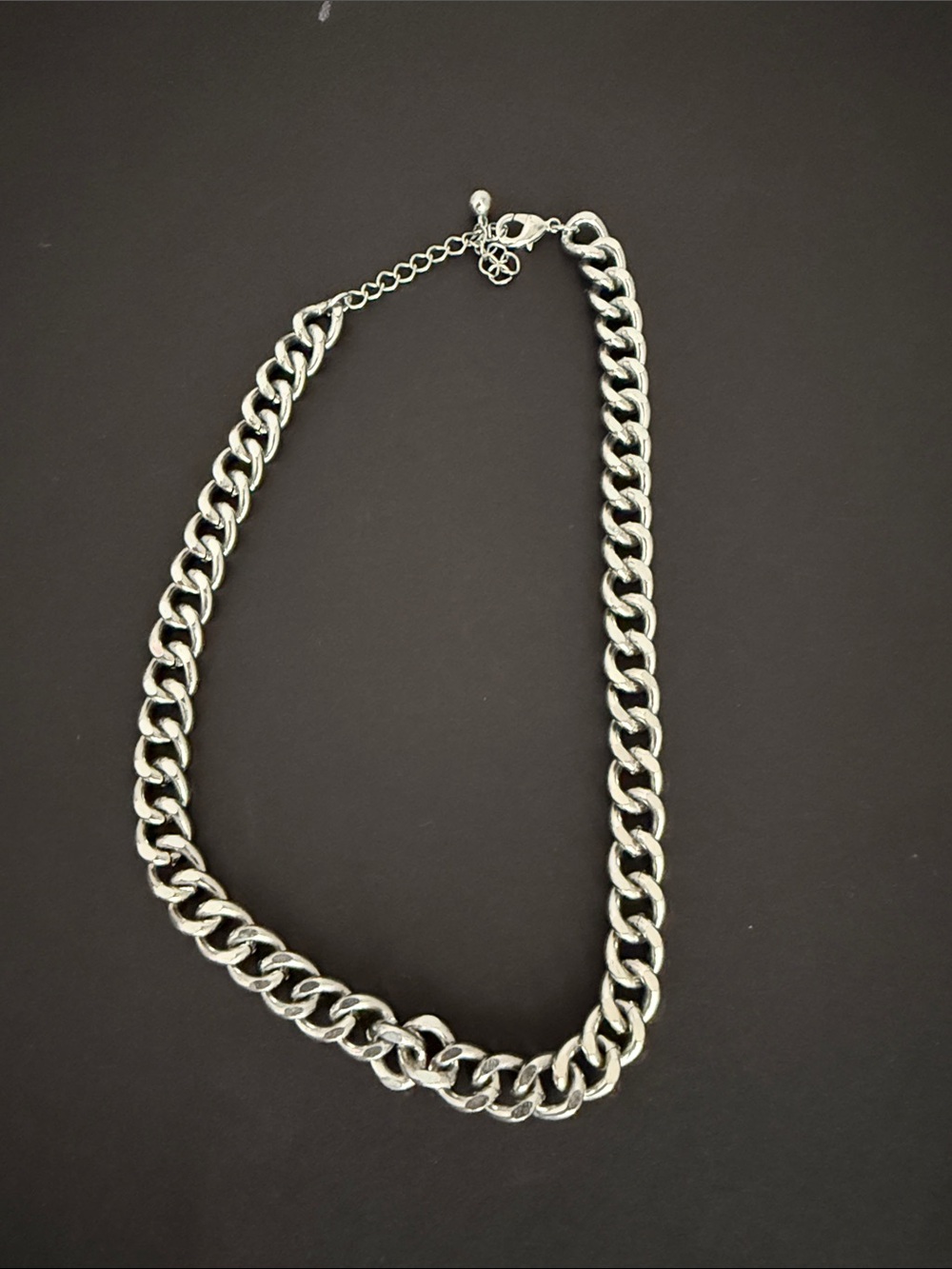 silver chunky cuban link chain necklace, also  referred to as a curb chain.